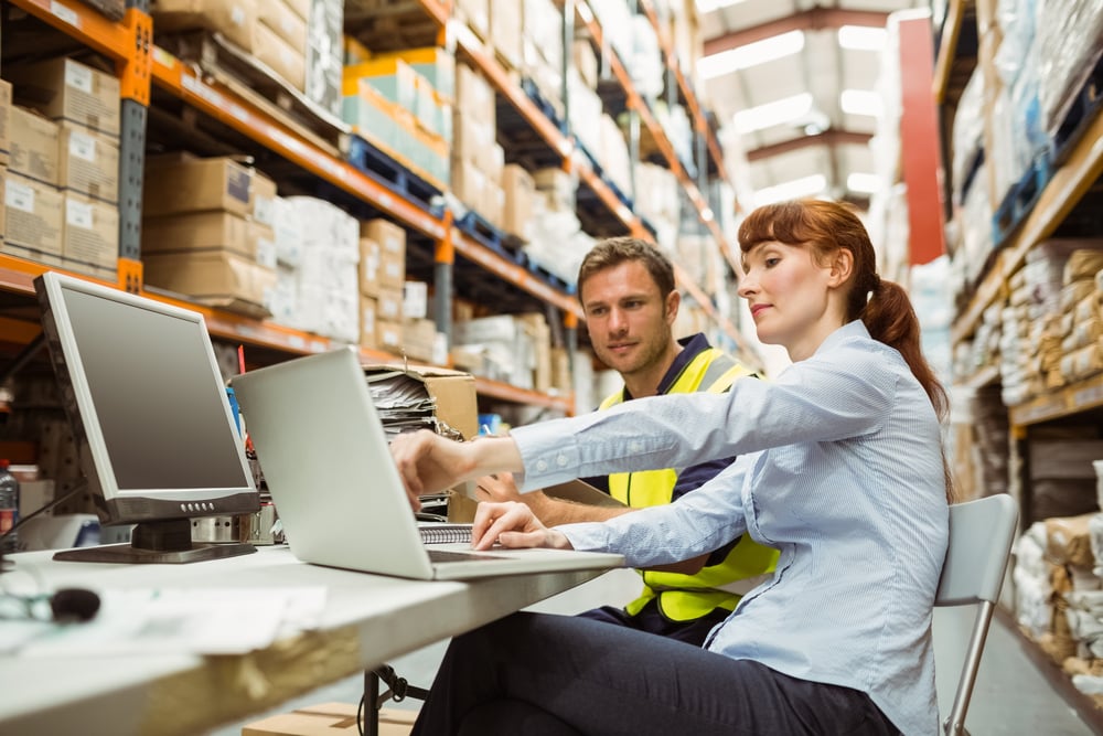 Warehouse manager checking new orders to process